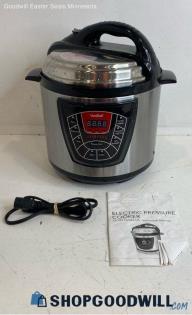 Vonshef Silver 8 In 1 Electric Stainless Steel Pressure Cooker Powered on