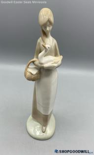 Girl/Women Tan Dress W/ White Apron Carrying Her Basket Holding A Duck Figurine