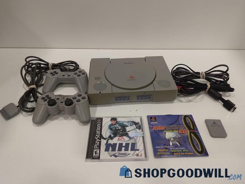 PlayStation Console W/Game, Cords and Controllers-powers on