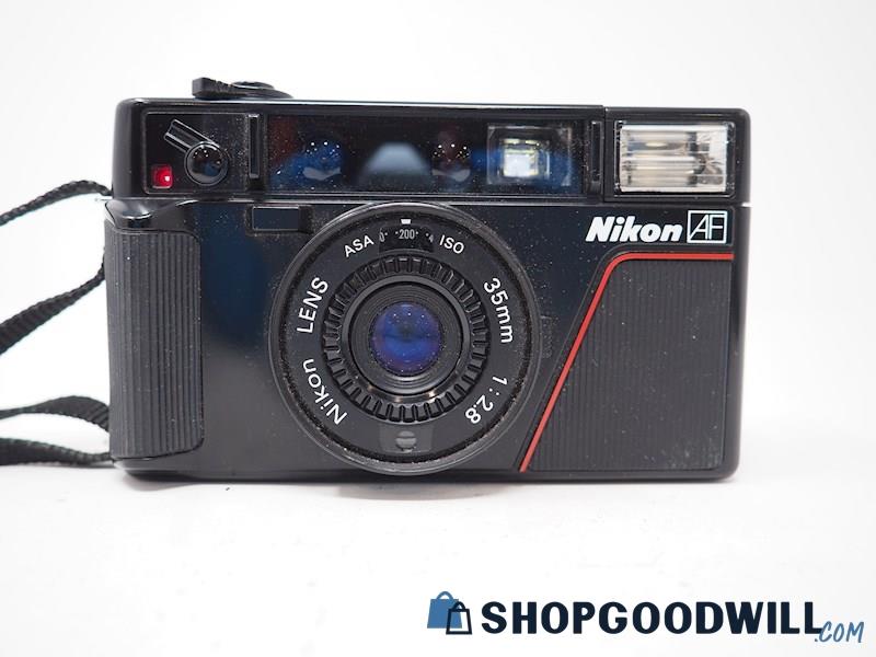 Nikon L35 AF 35mm Point & Shoot Film Camera *Powers ON*