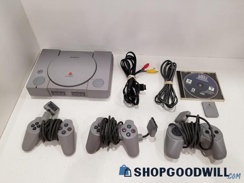 PlayStation Console w/ Game, Cords & Controllers - PS1 POWERS ON