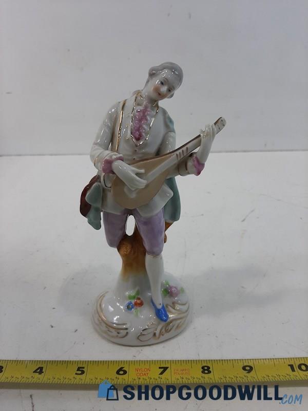 Unlabeled Figurine of a Man Playing A Mandolin 7