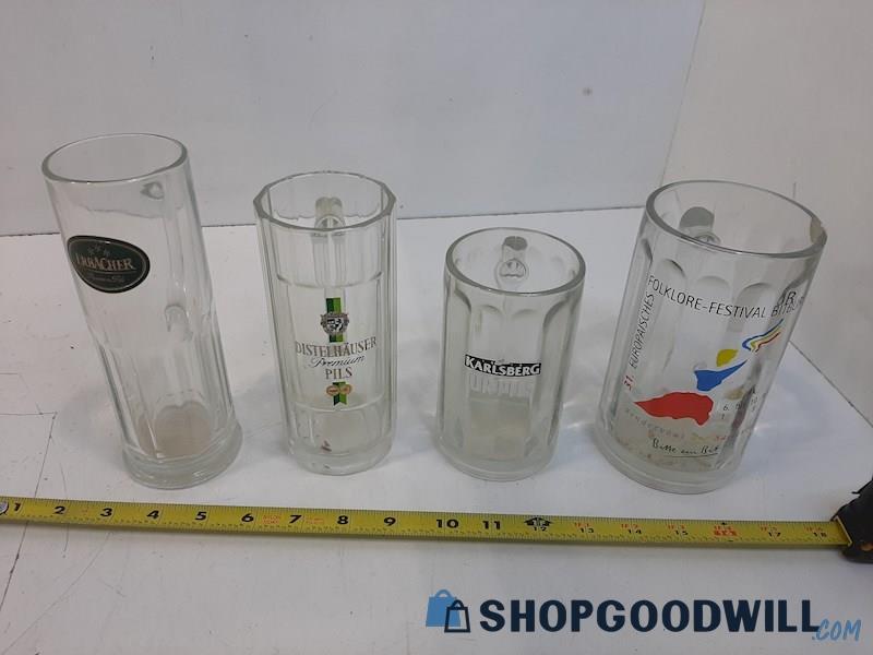 4 Asstd. Clear Glass Beer Mugs With Different Brands On Them