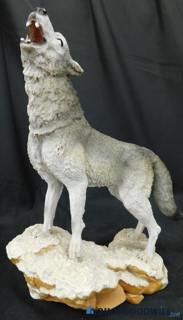 Large Resin Wolf Howling On Snowy Mountain Statue. | ShopGoodwill.com