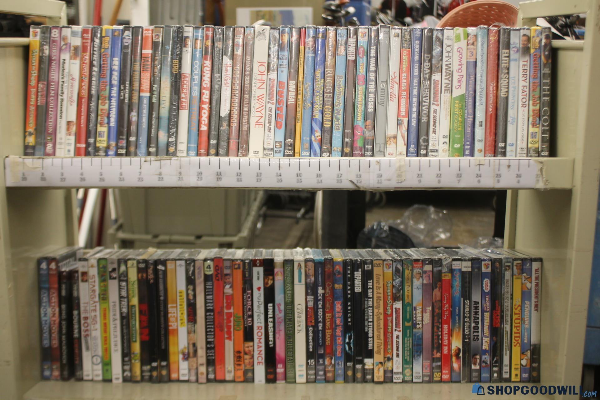 100 + New DVD Movies - shopgoodwill.com